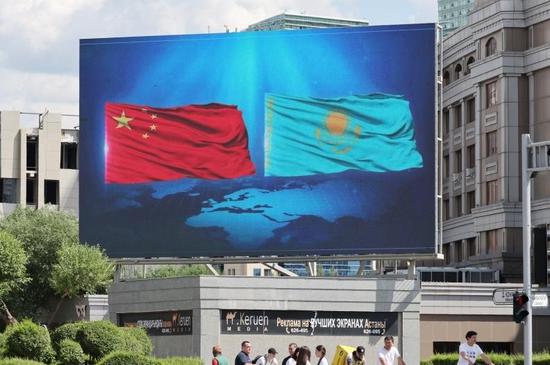 National flags of China and Kazakhstan flutter along streets of Astana