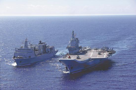 The carrier groups of the Liaoning and Shandong conduct far-sea combat training in recent days. The photo shows the groups carrying out an at-sea replenishment. (Photo by Wang Jian / for China Daily)