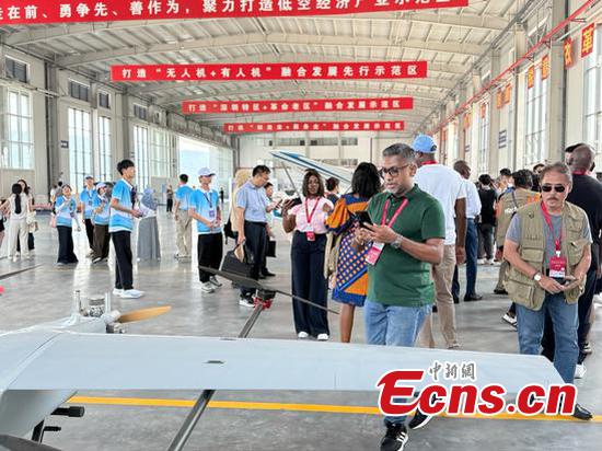 International journalists visit the low-altitude economy industrial park in Nankang district of Ganzhou, Jiangxi Province, July 16, 2025. (Photo: China News Network/ Huang Fang)