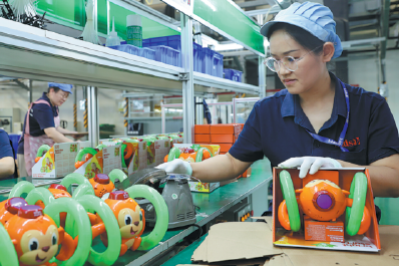 Employees work on the production line of a foreign-funded company specializing in making toys for European and US markets. (WEI DONGSHENG/FOR CHINA DAILY)