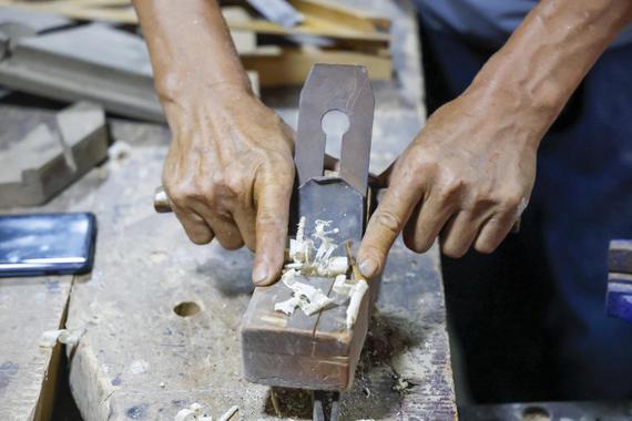 After dedicating himself to furniture-making for 40 years, 59-year-old Lu Junfang now promotes wooden handicrafts via livestream from Shizuishan, Ningxia Hui autonomous region. (Photo provided to chinadaily.com.cn)