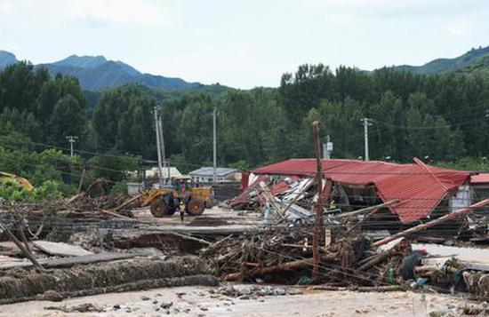 Beijing plugs safety gaps amid rain alert
