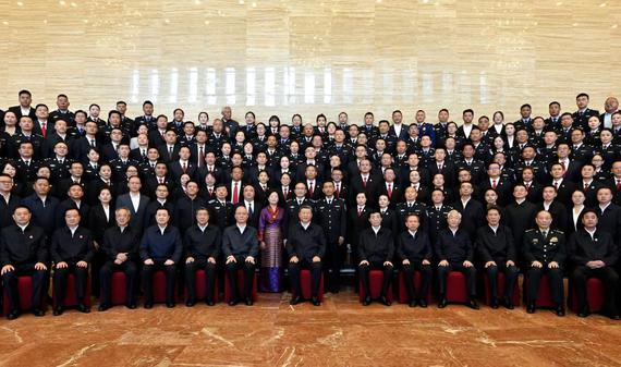 Chinese President Xi Jinping, also general secretary of the Communist Party of China Central Committee and chairman of the Central Military Commission, poses for a group photo while meeting with representatives of judicial workers and police officers in Lhasa, southwest China's Xizang Autonomous Region, Aug. 20, 2025. (Xinhua/Yin Bogu)