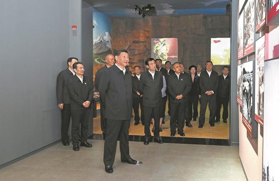 President Xi Jinping visits a themed exhibition marking the 70th anniversary of the founding of the Xinjiang Uygur autonomous region at a cultural center in Urumqi, the capital of Xinjiang, on Wednesday morning. YAN YAN/XINHUA