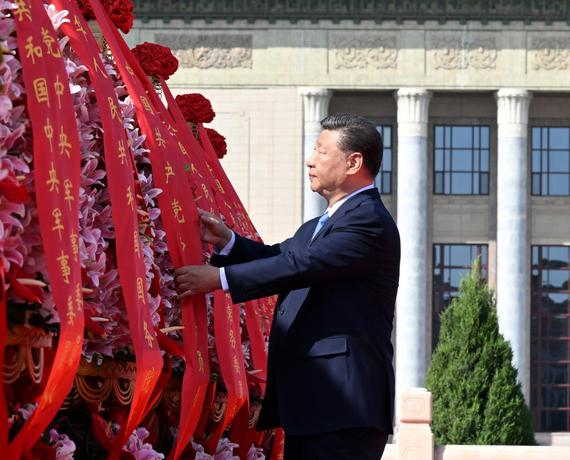 Xi Jinping straightens the ribbon on a flower basket during a ceremony to present flower baskets to fallen national heroes at Tian'anmen Square in Beijing, capital of China, Sept. 30, 2025. Chinese President Xi Jinping and other leaders of the Communist Party of China and state including Li Qiang, Zhao Leji, Wang Huning, Cai Qi, Ding Xuexiang, Li Xi and Han Zheng on Tuesday attended the ceremony. The event was held to mark Martyrs' Day, a day ahead of the National Day in China. (Xinhua/Li Xiang)