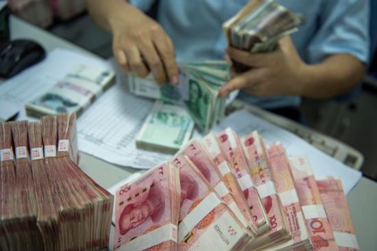 Central bank to enhance market guidance to keep yuan stable