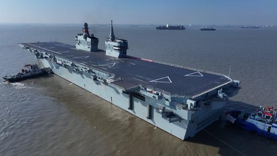 China's largest amphibious assault ship sets off on maiden sea trial
