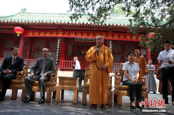 Photo shows Shi Yongxin (center), former abbot of the renowned Shaolin Temple. (File photo courtesy of Shaolin Temple)