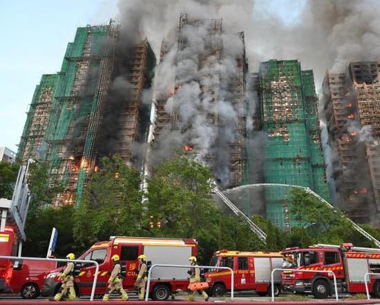 Fire engulfs Hong Kong residential blocks, killing 44 people