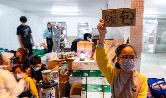 Youths assist residents affected by Hong Kong residential area fire