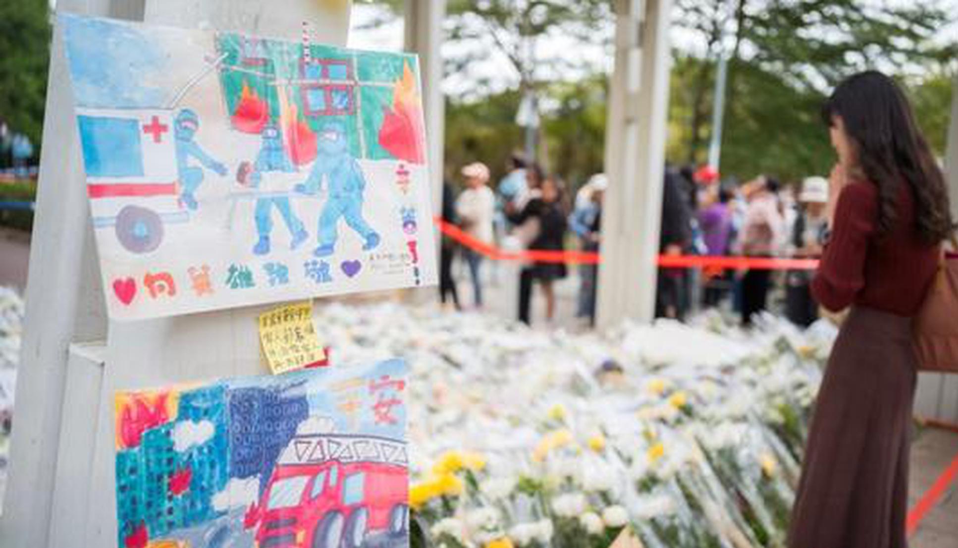 13 people arrested for suspected manslaughter after Hong Kong's fire: authorities