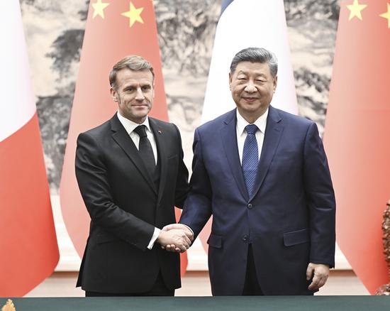 Xi holds talks with Macron, calling for expanded cooperation in multiple areas