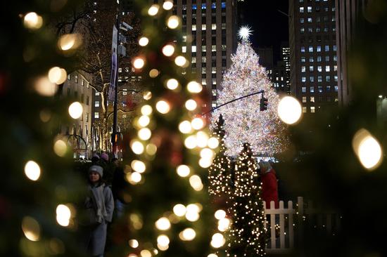 Rockefeller Center Christmas tree illuminated in New York