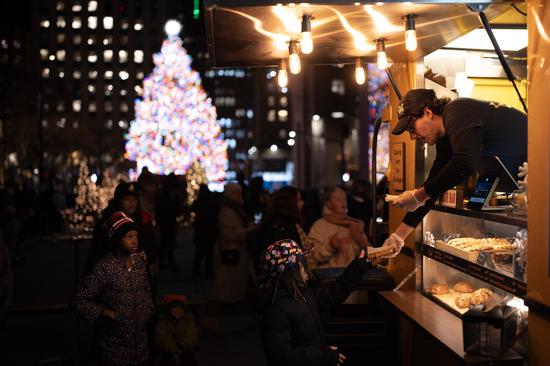 Rockefeller Center Christmas tree illuminated in New York