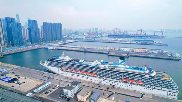 An aerial drone photo taken on May 27, 2025 shows cruise ship Adora Mediterranea docking at a port in Dalian, northeast China's Liaoning Province. (Xinhua/Pan Yulong)