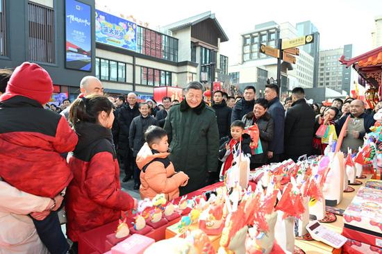 Chinese President Xi Jinping, also general secretary of the Communist Party of China Central Committee and chairman of the Central Military Commission, talks with people while visiting a Spring Festival market at the Longfusi commercial area in Dongcheng District of Beijing, capital of China, Feb. 10, 2026. Xi visited primary-level officials and residents in Beijing during a two-day inspection tour from Monday to Tuesday. (Xinhua/Xie Huanchi)