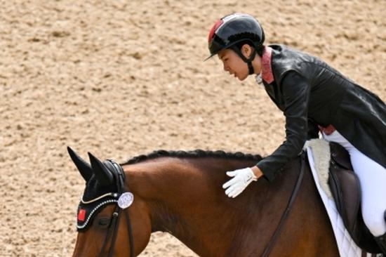 Chinese equestrian riding high Down Under