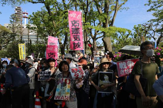 Japanese protesters rally against government's militarization push