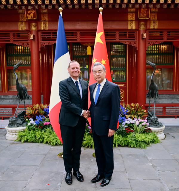 Wang Yi, director of the Office of the Central Commission for Foreign Affairs, met with Emmanuel Bonne, diplomatic adviser to the French President in Beijing on Friday. (Photo / MFA)