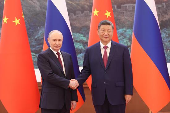 Xi holds talks with Putin in Beijing