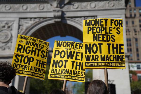 Demonstrators holding placards participate in a rally to mark the International Workers' Day in New York, the United States, May 1, 2026. (Xinhua/Zhang Fengguo)