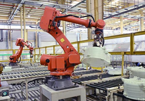 Robotic arms grab parts of washing machines on a production line at the Haier Qingdao Washing Machine Interconnected Factory in Qingdao, east China's Shandong Province, May 12, 2026. (Xinhua/Li Ziheng)