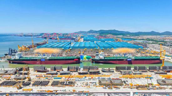 Two very large crude carriers named and delivered by Chinese builder on same day