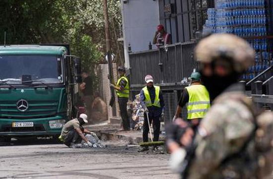 Iraqi armed group threatens to attack U.S. bases if Washington joins attacks on Iran