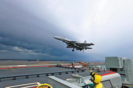 Navy's carrier battle group back after drill