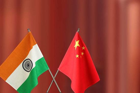 China, India should regard each other as partners: Wang Yi