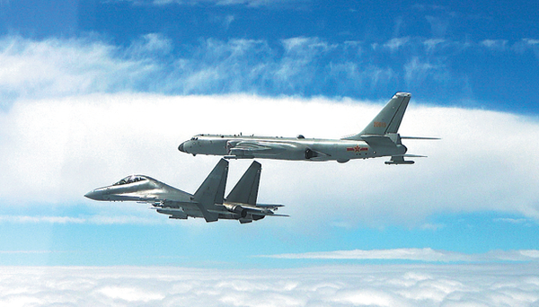 Participating aircraft in action during the 11th China-Russia joint strategic air patrol on Saturday. (ZENG JIAWEI/XINHUA)