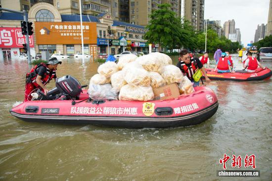 Rescue teams and supplies rush to flood-hit Guigang