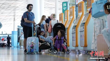 Foreign passengers check in at Beijing Capital International Airport on July 15, 2026. (Photo: Courtesy of Beijing Capital International Airport)