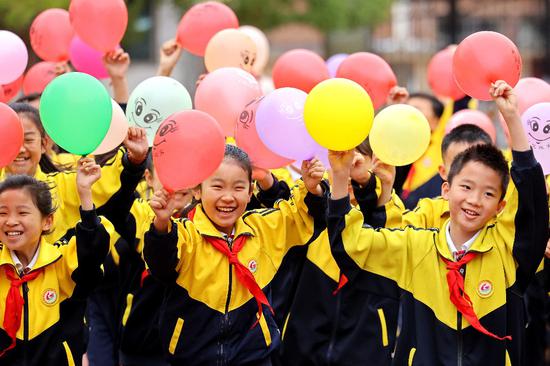 Xi stresses fostering virtue through education, promoting high-quality basic education
