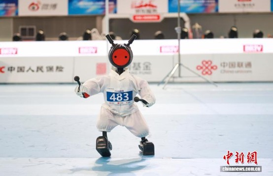 Robots compete in tai chi events at the National Speed Skating Oval in Beijing, August 23, 2026, during the 2nd World Humanoid Robot Games. (Photo: China News Service / Jia Tianyong)