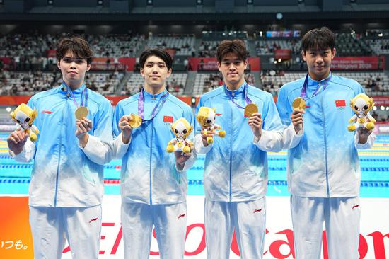China sets Asian record to win men's 4x200m freestyle relay at Asian Games
