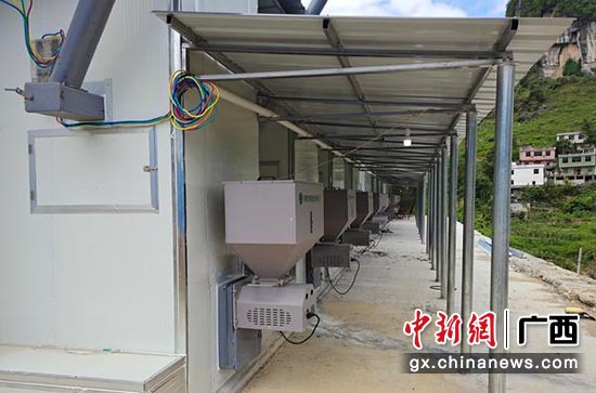 新建的燃烧生物质颗粒烤房。欧应彬 摄 新建的燃烧生物质颗粒烤房。欧应彬 摄