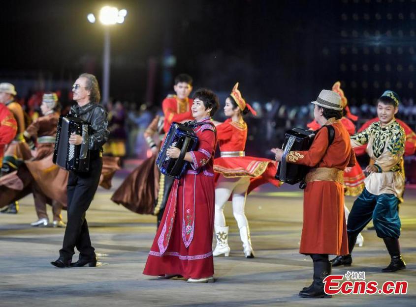 Artists from Tacheng Prefecture, northwest China's Xinjiang Uyghur Autonomous Region, perform a dance during the first folk art season in Urumqi, capital of Xinjiang, Aug. 20, 2024. (Photo: China News Service/Liu Xin)