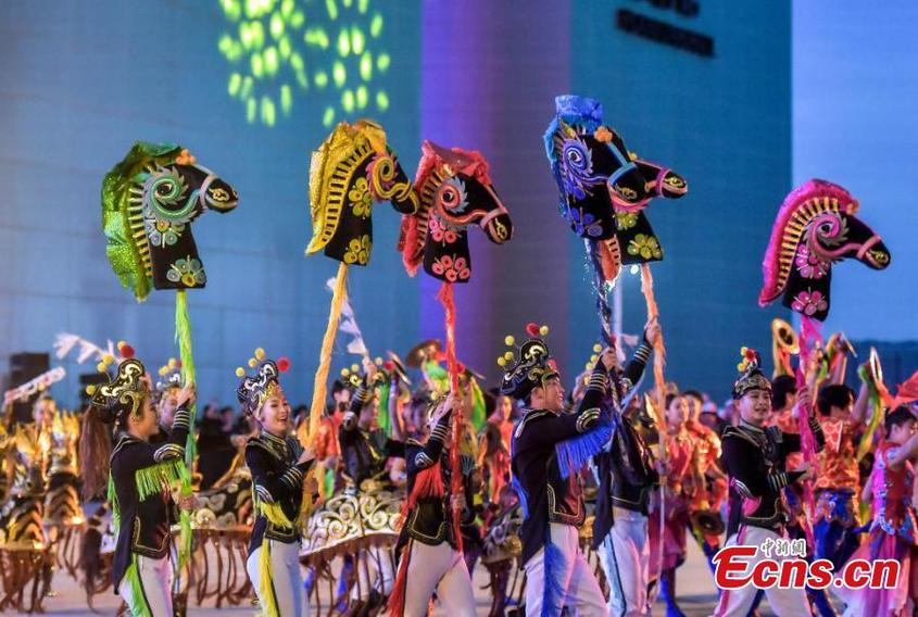 Artists from Tacheng Prefecture, northwest China's Xinjiang Uyghur Autonomous Region, perform a dance during the first folk art season in Urumqi, capital of Xinjiang, Aug. 20, 2024. (Photo: China News Service/Liu Xin)