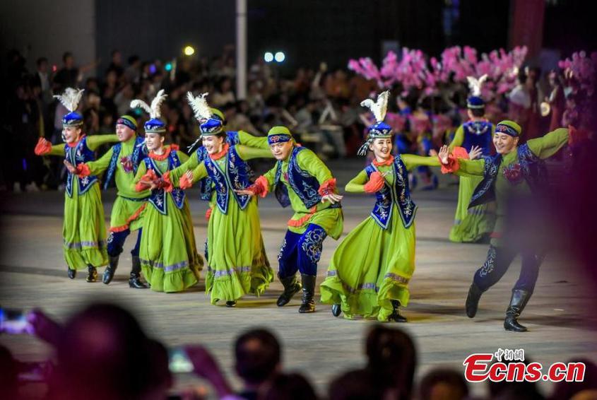 Artists from Tacheng Prefecture, northwest China's Xinjiang Uyghur Autonomous Region, perform a dance during the first folk art season in Urumqi, capital of Xinjiang, Aug. 20, 2024. (Photo: China News Service/Liu Xin)