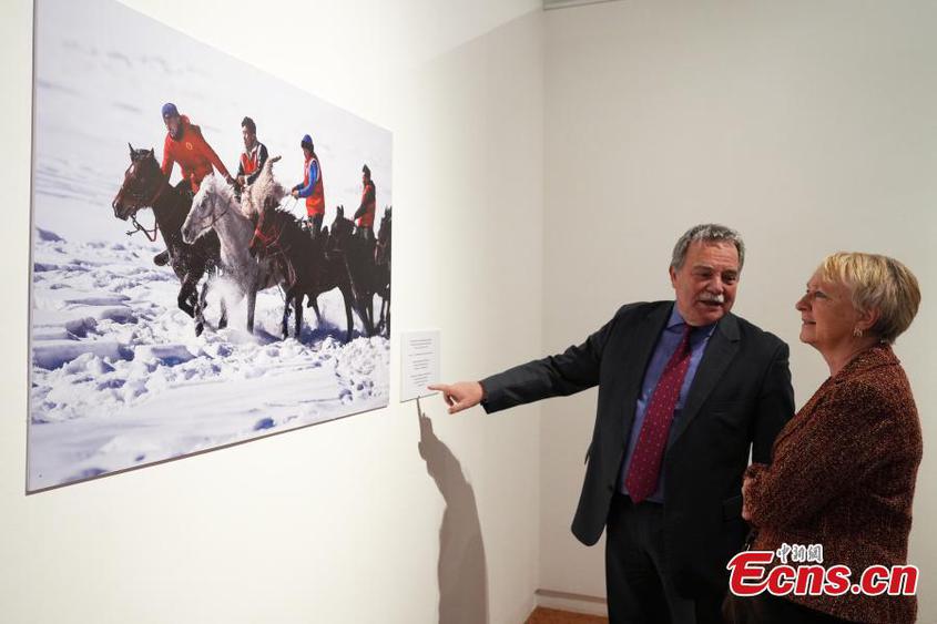 Visitors view photo exhibition commemorating the 70th founding anniversary of China's Xinjiang Uygur Autonomous Region in Astana, Kazakhstan, on Dec. 10, 2025. (Photo: China News Service/Shan Lu)

The photo exhibition commemorating the 70th founding anniversary of China's Xinjiang Uygur Autonomous Region opened Wednesday in Astana.