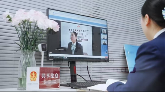 金华中支工作人员通过金融“共享法庭”云端调解。