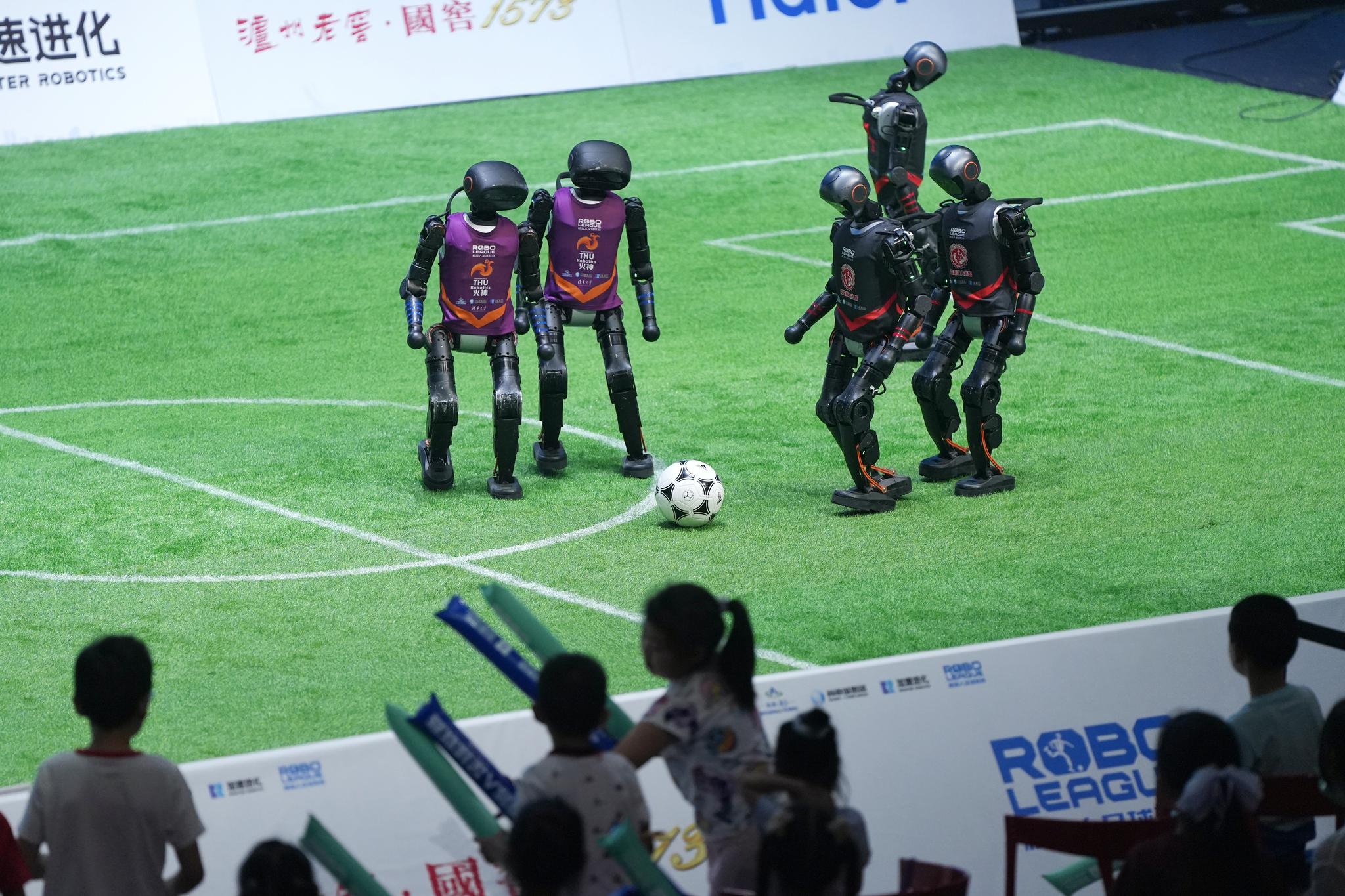 China launches first 3v3 AI robot football match
