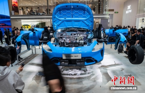 A disassembled Xiaomi car is on display at the 19th Beijing International Automotive Exhibition, April 24, 2026. (Photo: China News Service/Hou Yu)