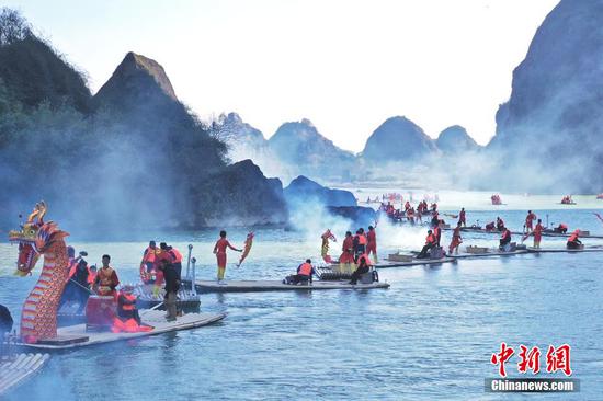 'Colorful dragons' drift on river in Guangxi