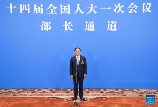 Minister of Industry and Information Technology Jin Zhuanglong gives an interview after the opening meeting of the first session of the 14th National People's Congress (NPC) in Beijing, capital of China, March 5, 2023. (Xinhua/Cai Yang)