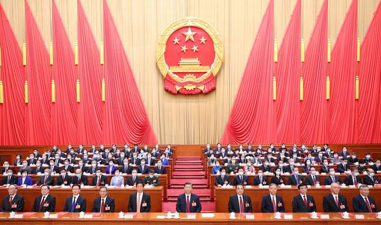 Xi Jinping and other Chinese leaders attend the closing meeting of the first session of the 14th National People's Congress (NPC) at the Great Hall of the People in Beijing, capital of China, March 13, 2023. (Xinhua/Huang Jingwen)