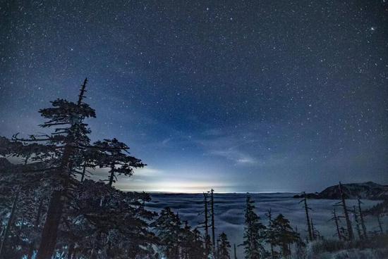 Starry night over sea of clouds on Qinling Mountain