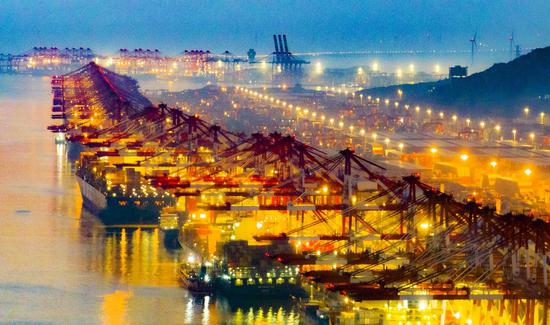 Container ships in operation at Yangshan Deep-Water Port in Shanghai