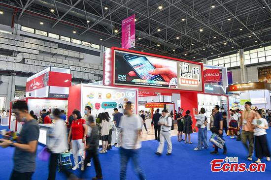 Visitors are seen in the Macao Exhibition Hall at the Third China International Consumer Products Expo held at Haikou, South China's Hainan Province, April 13, 2023. (Photo: China News Service/ Luo Yunfei) 

